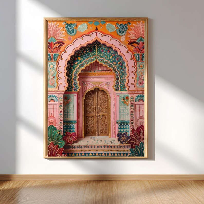 May include: A framed print depicting an ornate archway and door. The artwork is richly detailed, using pink, orange, green, and gold. The wooden door features intricate carvings. The style evokes Indian architecture, with a focus on decorative elements.