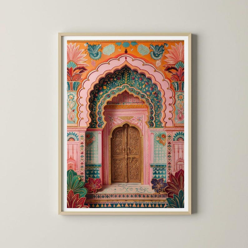 May include: Framed print of an ornate doorway with detailed carvings and floral designs. The artwork uses a vibrant colour palette of pink, orange, green, and gold, suggesting cultural richness and architectural detail. The print is framed in a light wood.
