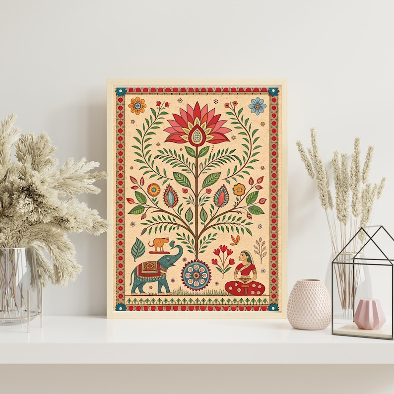 May include: A framed art print featuring a colorful, stylized tree design. The artwork includes a red lotus flower, an elephant, and a woman in traditional Indian attire. The print has a cream-colored background and a decorative red border.