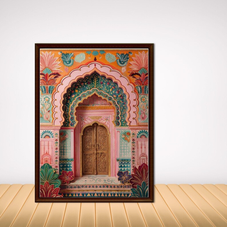 May include: A framed print depicting an ornate Indian palace entrance. The artwork showcases a detailed archway and door in shades of pink, green, and gold, with floral and geometric patterns. The frame is a dark brown colour.