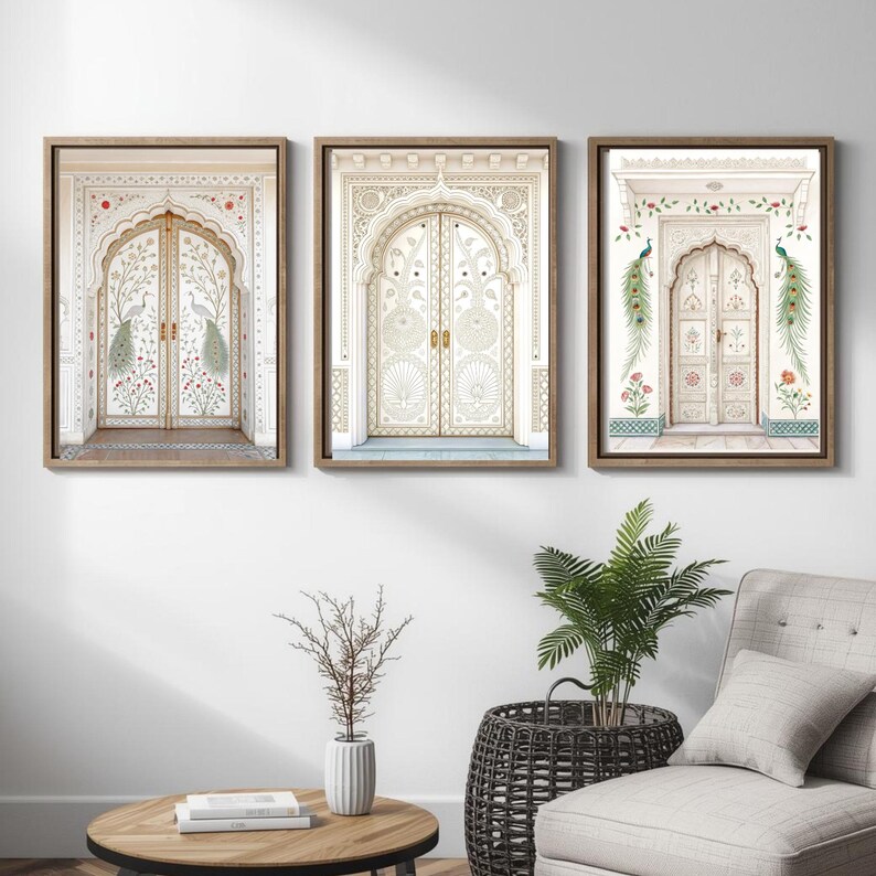 May include: Three framed wall art pieces featuring ornate, cream-colored doors with intricate designs. The doors are adorned with floral and peacock motifs, set against a neutral background. The artwork is encased in wooden frames, creating a cohesive set.