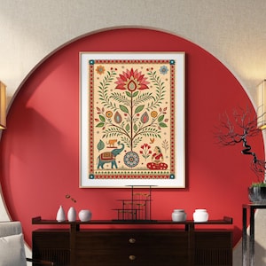 May include: A framed, colorful Indian folk art print. The artwork features a central tree design with a large lotus flower at the top. The tree is adorned with leaves, flowers, and animals, including an elephant. A woman in red sits at the base.