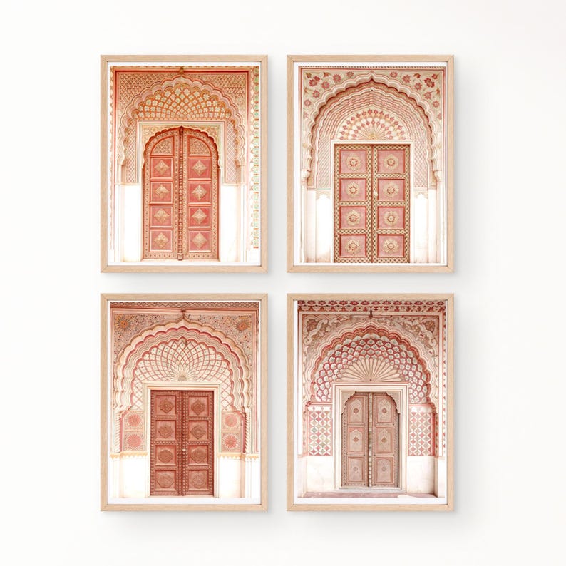 May include: Four framed prints featuring architectural door designs. Each print showcases a detailed, arched doorway with intricate patterns in shades of peach, coral, and cream. The doors are framed in light wood, creating a cohesive set for wall decor.