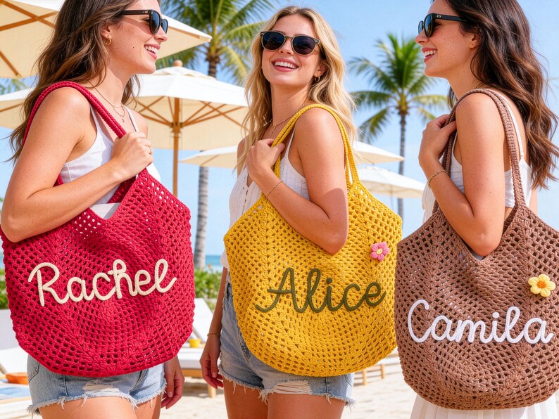 May include: Three women holding crochet tote bags. The bags are in red, yellow, and brown. Each bag has a name embroidered on it: Rachel, Alice, and Camila. The bags have a flower attached to them.