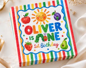 May include: A square paper napkin featuring a colourful striped border and a central white panel with the text OLIVER IS ONE 1st Birthday. The design includes a smiling sun, a green caterpillar, a red apple, a purple plum, a strawberry, and a pear.