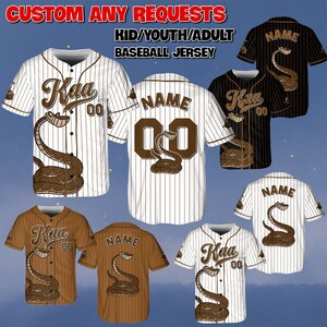 May include: Baseball jerseys in various colors, including white, black, and brown, with a snake graphic and the text "Kaa" and "00". The jerseys are available in kid, youth, and adult sizes. The text "CUSTOM ANY REQUESTS" and "BASEBALL JERSEY" are also visible.
