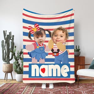 May include: A personalized blanket featuring two children's faces against a backdrop of red, white, and blue stripes. The blanket has the word "name" with a heart symbol. The children are wearing denim overalls and holding props.