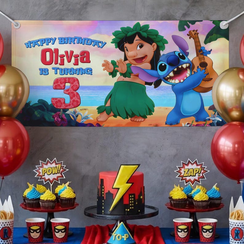 May include: A birthday party scene with a banner featuring Lilo and Stitch. The banner reads "Happy Birthday Olivia is turning 3." A red and black cake with a lightning bolt sits on a stand, surrounded by cupcakes and balloons.