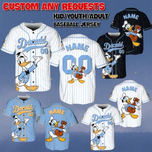 May include: Baseball jerseys in various colors, featuring Donald Duck graphics. The jerseys are available in white, blue, and black with pinstripes. The text "Donald" and "Name" are displayed on the jerseys, along with the number "00".