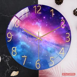 May include: Round wall clock with a galaxy design in shades of blue, purple, and pink. The clock features gold-colored hands and numerals. The text "2D FLAT PAINTING" is in the bottom right corner.
