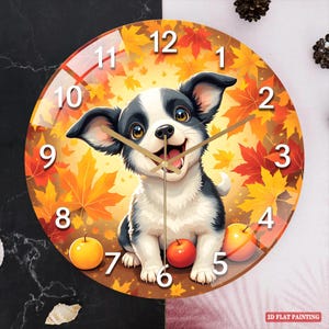 May include: Round wall clock featuring a cartoon puppy with a black and white coat, set against a backdrop of autumn leaves. The clock face displays large, easy-to-read numbers and golden clock hands. Two apples are at the bottom of the clock.
