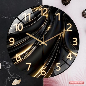 May include: A round wall clock with a black and gold abstract design. The clock face features gold numerals and hands against a dark background with flowing, wave-like patterns. The clock's diameter is approximately 12 inches.