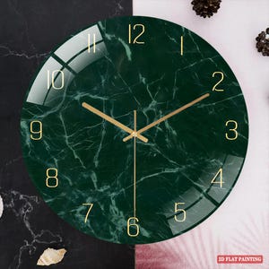 May include: A round wall clock with a dark green marble-like face and gold-colored hands and numerals. The clock has a glass cover and a minimalist design. The text "2D FLAT PAINTING" is in the bottom right corner.