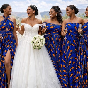 May include: A white off-the-shoulder wedding dress with a lace bodice and full skirt, alongside four matching floor-length bridesmaid dresses in a vibrant blue and orange teardrop pattern, featuring high leg slits and varied necklines.