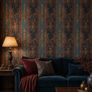 May include: A living room scene featuring a dark blue velvet sofa with burgundy pillows and a matching throw. The room has patterned wallpaper in teal, gold, and burgundy. A wooden coffee table and a table lamp with a beige shade complete the scene.