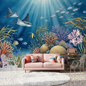 May include: A vibrant underwater-themed room featuring a pink sofa with decorative pillows, a fluffy white rug, and clear chairs. The wall is adorned with a colorful mural of marine life, including stingrays, fish, and coral reefs, creating a serene and artistic ambiance.
