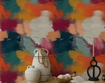 May include: Abstract art wallpaper with a vibrant mix of colors including orange, teal, pink, and white brushstrokes. A wooden table displays decorative vases, a candle holder, a small basket with balls, and an open book. The overall theme is home decor.