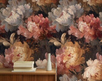 May include: A wallpaper design with large, painterly peonies in cream, peach, and coral hues against a dark backdrop. The artwork has a textured, brushstroke effect, creating a vintage aesthetic. A wooden cabinet with books and a white vase is in the foreground.