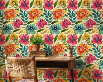 May include: A vibrant floral wallpaper featuring a repeating pattern of large, colorful flowers in shades of pink, orange, yellow, and teal. The flowers are set against a cream-colored background, with green leaves and stems. A wooden desk and chair are in the foreground.