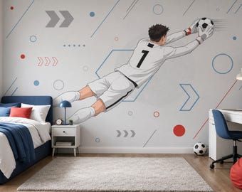 May include: A bedroom with a soccer theme. A mural of a soccer goalie diving for the ball dominates the wall. The room includes a bed with blue bedding, a desk, and a soccer ball on the floor. The color scheme is primarily white, blue, and red.