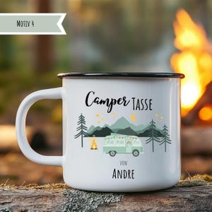 May include: White enamel camping mug with a black rim, featuring the text "Camper Tasse" and a graphic of a green camper van, mountains, trees, and a campfire. The mug also includes the name "Andre".