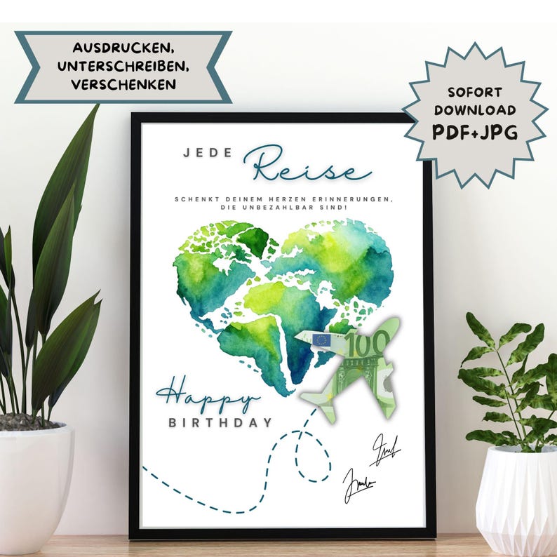 May include: A framed print featuring a watercolour heart-shaped world map in green and blue. The print includes the words "Happy Birthday" and "Jede Reise" with additional text and a paper airplane design. The words "SOFORT DOWNLOAD PDF+JPG" are also included.