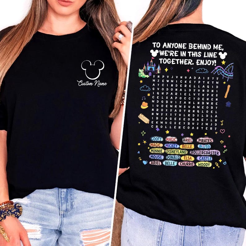 A woman wearing a black t-shirt with a personalized message and various Disney-themed illustrations on the back.