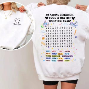 A white sweatshirt with a message and a list of Disney characters printed on it.