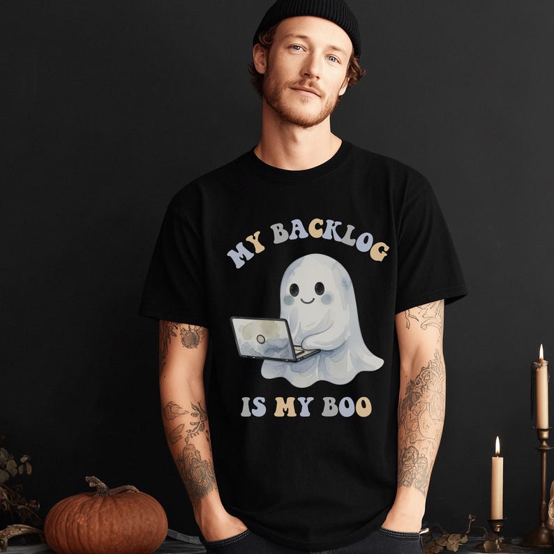 Funny unisex developer Halloween shirt with a cute ghost using a laptop and the phrase “My Backlog Is My Boo,” perfect for programmers, scrum masters, coders, agile teams, and tech nerd gifts.