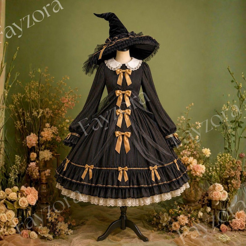 May include: A black long-sleeved dress with a white collar, featuring vertical pinstripes, gold ribbon bows down the front, and a ruffled hem with white lace trim. The dress is paired with a matching black wide-brimmed witch hat with gold trim.
