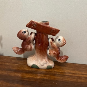 Vintage squirrels in tree salt and pepper shakers.
