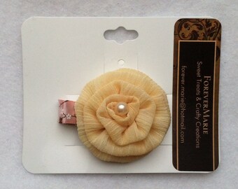 Yellow rosette with pearl center hair clip