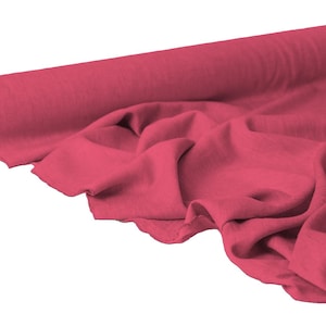 May include: A roll of vibrant red fabric, partially unrolled to reveal the texture. The fabric is a solid color and appears soft, with visible folds and creases. The background is plain white.