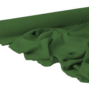 May include: A roll of dark green fabric, partially unrolled to reveal the draped material. The fabric has a soft, flowing appearance, with visible folds and creases. The roll is cylindrical, with a cardboard core. The color is a deep, forest green.