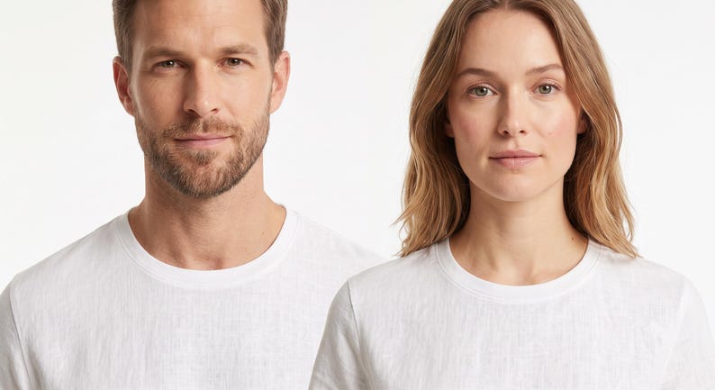 May include: Two individuals are shown wearing plain white crew neck t-shirts. The shirts feature a standard short-sleeve design with a simple round neckline, constructed from a lightweight fabric with a visible, subtle woven texture throughout.