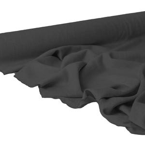 May include: A roll of dark gray fabric, partially unrolled to reveal the draped material. The fabric appears soft and has a matte finish. The roll is cylindrical with a cardboard core. Ideal for sewing and crafting projects.
