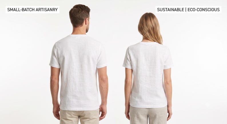 May include: Two plain white short-sleeve t-shirts shown from the back. The left side features the text SMALL-BATCH ARTISANRY, and the right side features the text SUSTAINABLE | ECO-CONSCIOUS. Both shirts are worn with neutral-coloured trousers.