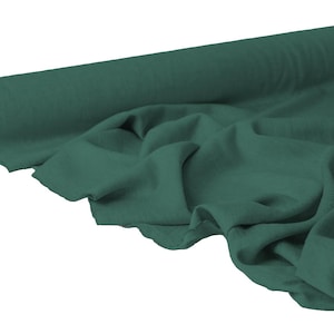 May include: A roll of dark teal fabric, partially unrolled to reveal the soft texture. The fabric is draped, showing its flexibility and potential for various sewing projects. The roll's core is visible, adding contrast to the solid color.