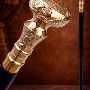 May include: A set of three ceramic mugs with a speckled, matte finish. The mugs are in shades of cream, light gray, and dark gray. Each mug has a simple, minimalist design and a rounded handle.