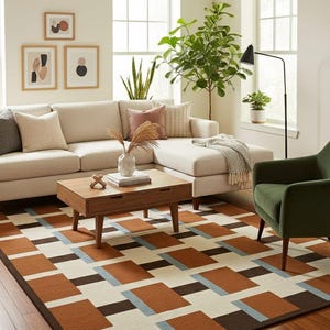 May include: A living room scene featuring a beige sectional sofa, a wooden coffee table, and a green armchair. A geometric patterned rug in shades of brown, white, and blue covers the floor. Decorative framed art hangs on the wall.