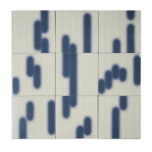 May include: A grid of nine square ceramic tiles arranged in a three-by-three pattern. Each off-white tile features a smooth, dark blue vertical pill-shaped graphic that creates a continuous, flowing abstract pattern across the entire surface.