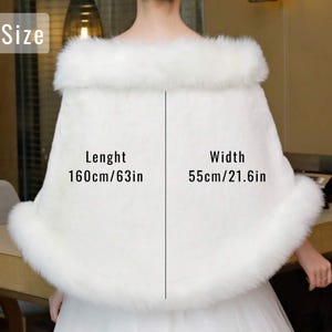 May include: A white faux fur shawl with a fluffy trim. The shawl measures 63 inches in length and 21.6 inches in width. The garment is designed to be worn over the shoulders. The image includes the word "Size".