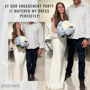 May include: A couple poses for a photo, the woman in a white dress and holding a bouquet of blue and white flowers. The man wears a button-down shirt and navy pants. Text at the top reads, "AT OUR ENGAGEMENT PARTY IT MATCHED MY DRESS PERFECTLY!"