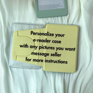 May include: A light yellow e-reader case with a clear plastic cover. The case has the text "Personalize your e-reader case with any pictures you want message seller for more instructions."