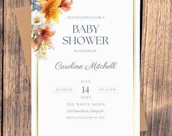 以下が含まれることがあります： ベビーシャワーの招待状。テキスト「Baby Shower」と、キャロライン・ミッチェルのシャワーの詳細（日付、時間、場所など）が記載されています。デザインには、金色のボーダーと花の装飾が施されています。