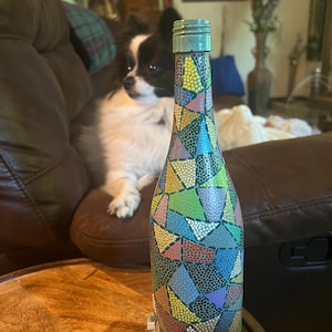 Decorative hand painted wine bottle. Painted wine bottle using dotting technique in mosaic style. Home decor or gift item.
