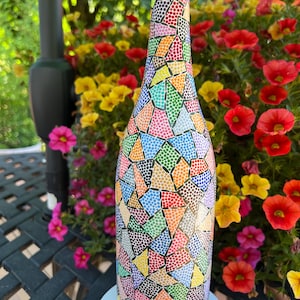 Decorative hand painted wine bottle. Home decor or gift item.
