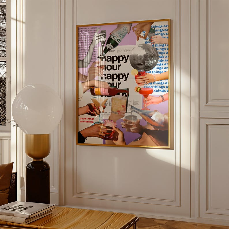 May include: A framed art print with a gold frame features a collage of hands holding cocktails and pouring drinks. The words "happy hour" are prominently displayed, along with other text. The artwork has a retro, vintage aesthetic.