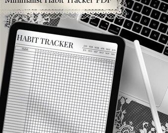 May include: A digital tablet displaying a habit tracker template with a grid layout, columns for habits, and rows for days 1 through 31. The header reads HABIT TRACKER with months January through December listed. A white stylus rests nearby.
