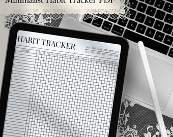 May include: A digital tablet displaying a habit tracker template with a grid layout, columns for habits, and rows for days 1 through 31. The screen shows the text "HABIT TRACKER" and months from January to December. A white stylus rests nearby.